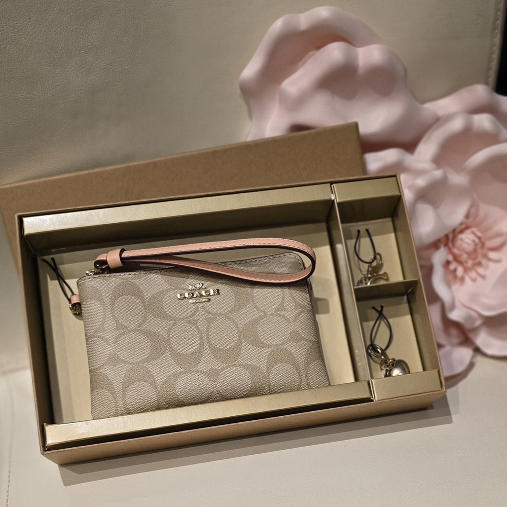 Coach Beige Wristlet with Pink Strap